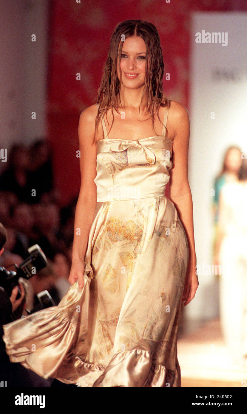 A beige satin gypsy dress, from the Paul Costelloe Spring/Summer 2000  range, is modelled during a catwalk show, on the first night of London Fashion  Week Stock Photo - Alamy