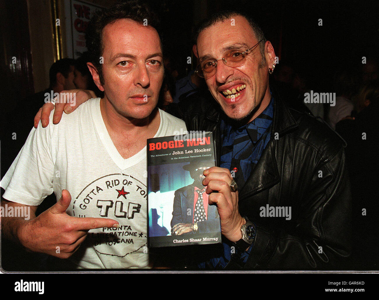 Joe Strummer (left), member of The Clash, and writer Charles Shaar Murray at the premiere of the BBC2 documentary 'Westway To The World' in Notting Hill in London. The film is about the career of the band, who split in 1986. Stock Photo