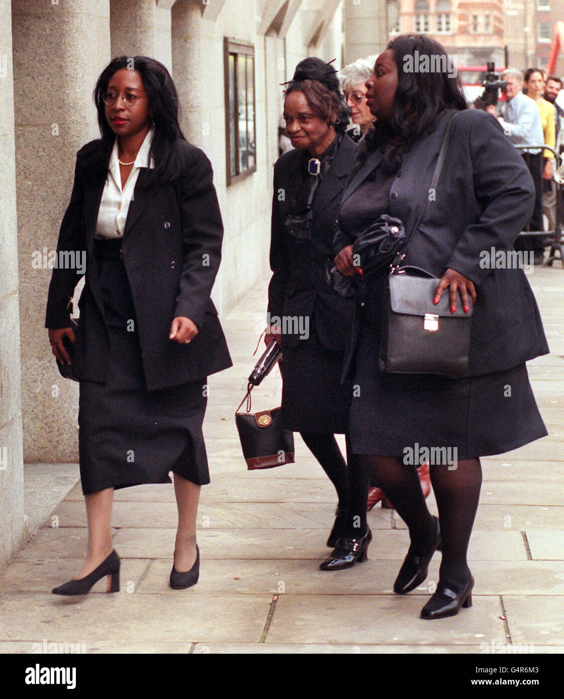 Venus Francisco, the mother of murdered doctor Joan Francisco arrives at the Old Bailey in London with her daughters Celia (left) and Margrette where the case against Anthony Diedrick continues. Stock Photo