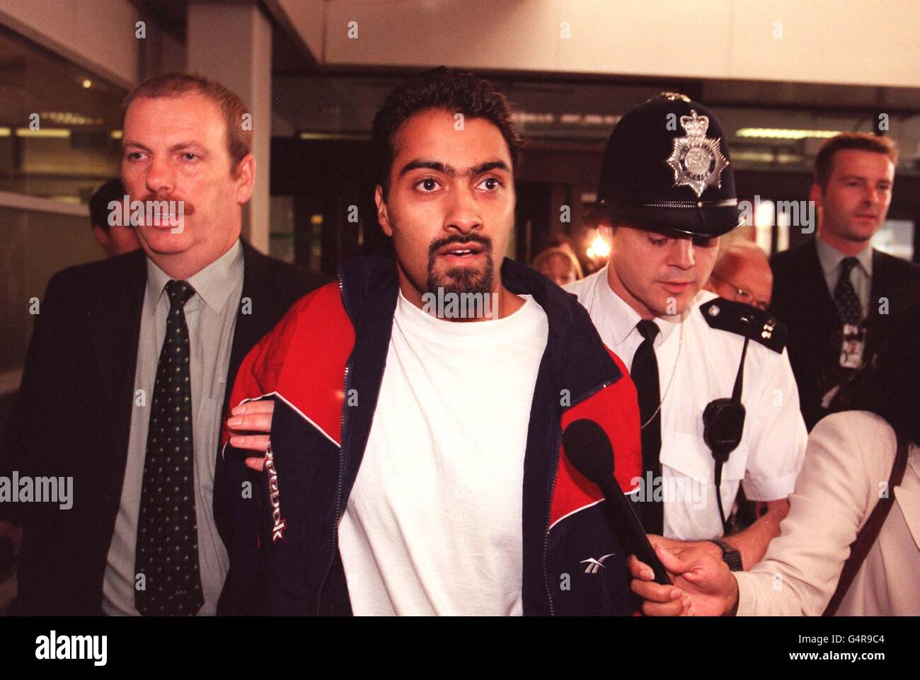 Ghulam Hussein at Heathrow Airport after arriving back from Yemen. Hussein, 25 was among eight Britons found guilty of a plan to bomb British targets in Aden, Yemen, but was sentenced to time he had already served while awaiting the trial last month. * Hussein was rushed through the airport terminal by police to be reunited with his family. Stock Photo