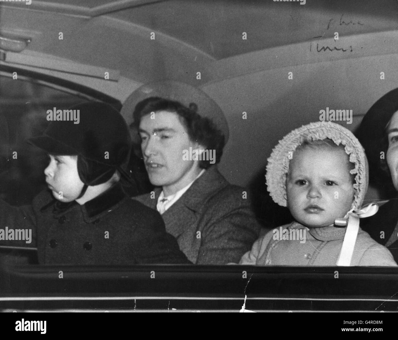 Prince Charles and Princess Anne with nanny Helen Lightbody, at King's Cross Station, London, where they met their grandparents, King George VI and Queen Elizabeth to travel to Sandringham. Princess Elizabeth and the Duke of Edinburgh had left for their Commonwealth tour. Stock Photo