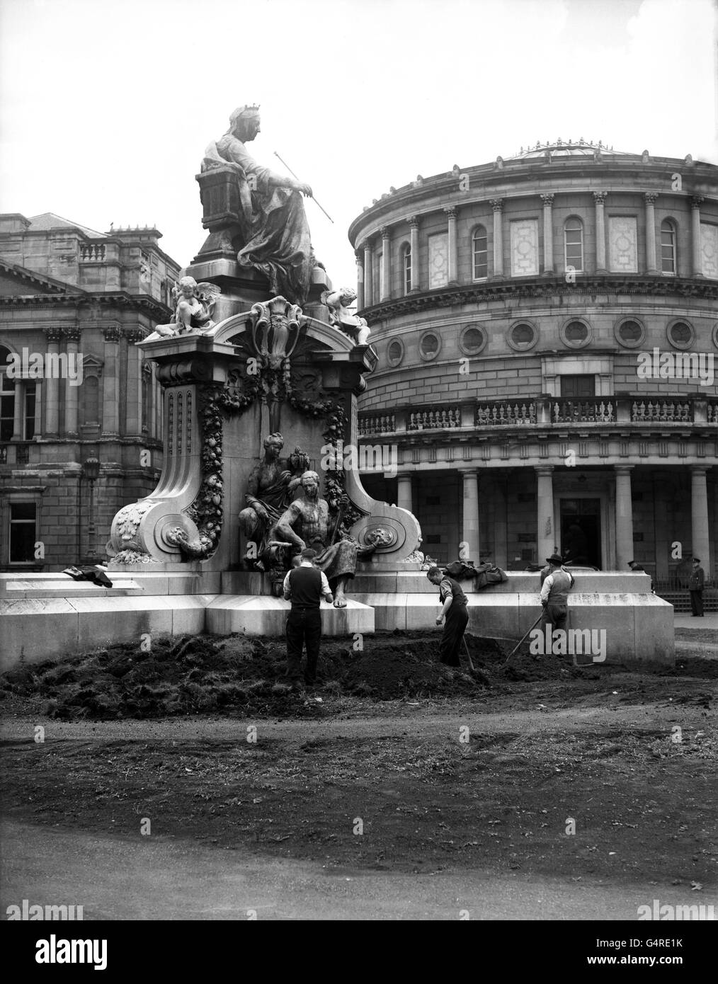 For many years the removal of this statue of Queen Victoria from the lawn in front of Leinster House , Dublin , was discussed but nothing was done about it . However , the Dail Deputies soon will be able to park their cars on the site . The statue is going to be stored at the Royal Hospital , Kilmainham , where there is an antiques museum . Photo shows ; Workmen commencing the removal of the statue . Stock Photo