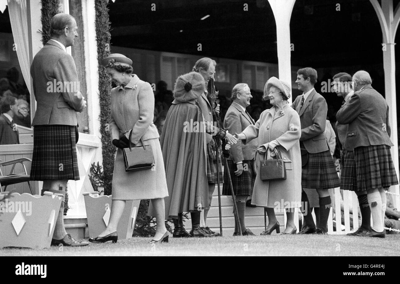 Queen Elizabeth II, the Duke of Edinburgh, the Queen Mother, Prince of Wales, and Prince Edward are greeted on arrival at the Gathering of the Braemar Royal Highland Society for the Braemar Games at the Princess Royal and Duke of Fife Memorial Park. Stock Photo