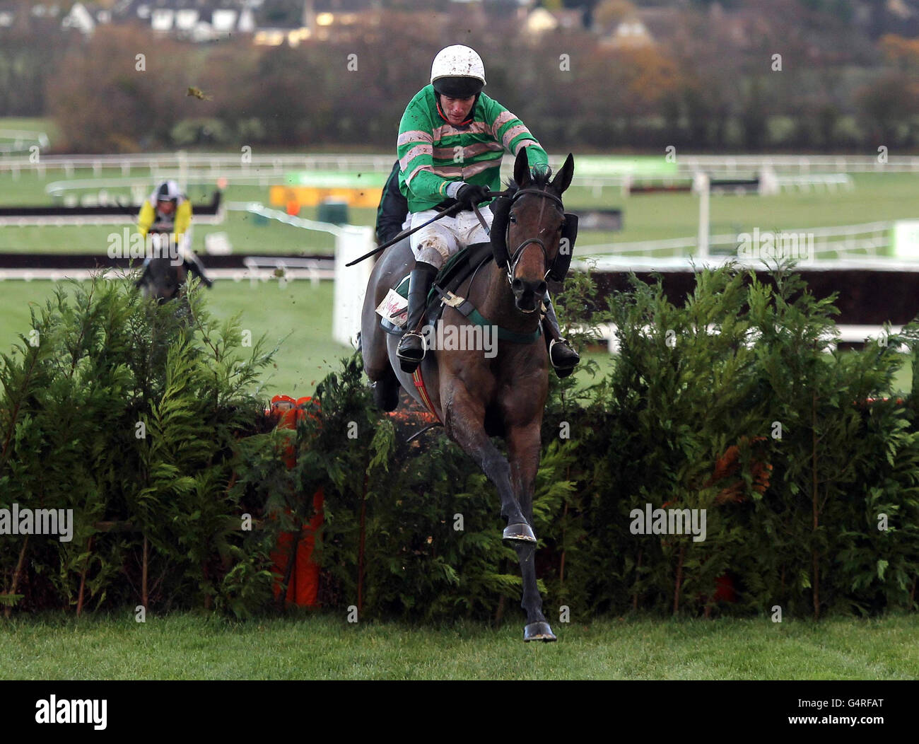 Garde Champetre ridden by JT McNamara jumps the last on their way to victory in the Glenfarclas Cross Country Handicap Chase during day one of The International at Cheltenham Racecourse. Stock Photo