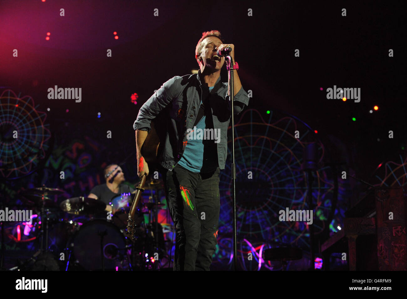 Drummer Will Champion, of Coldplay performs as they promote their fifth  studio album, Mylo Xyloto, released earlier this year, at The O2 Arena,  Greenwich, south London Stock Photo - Alamy