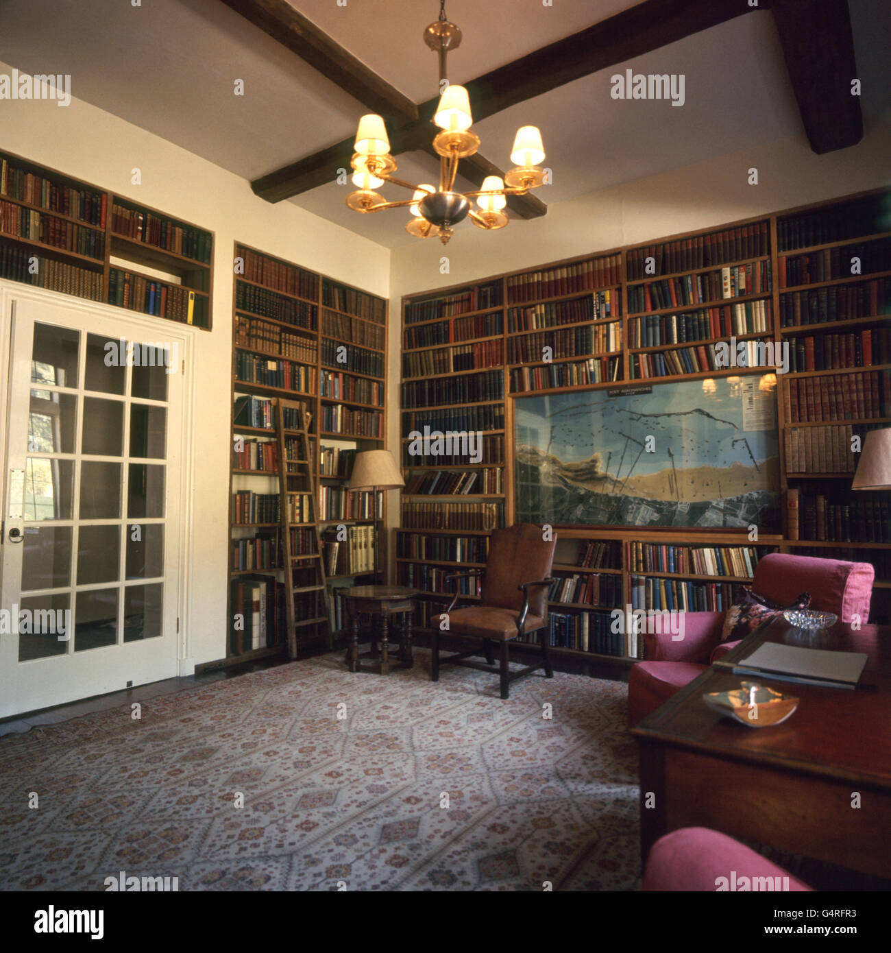 PA Photo 20/6/66 The library at Chartwell Manor, Westerham in Kent. Inset in bookcase is a model of the Mulberry Harbour at Arromanches, former home of Winston Churchill Stock Photo