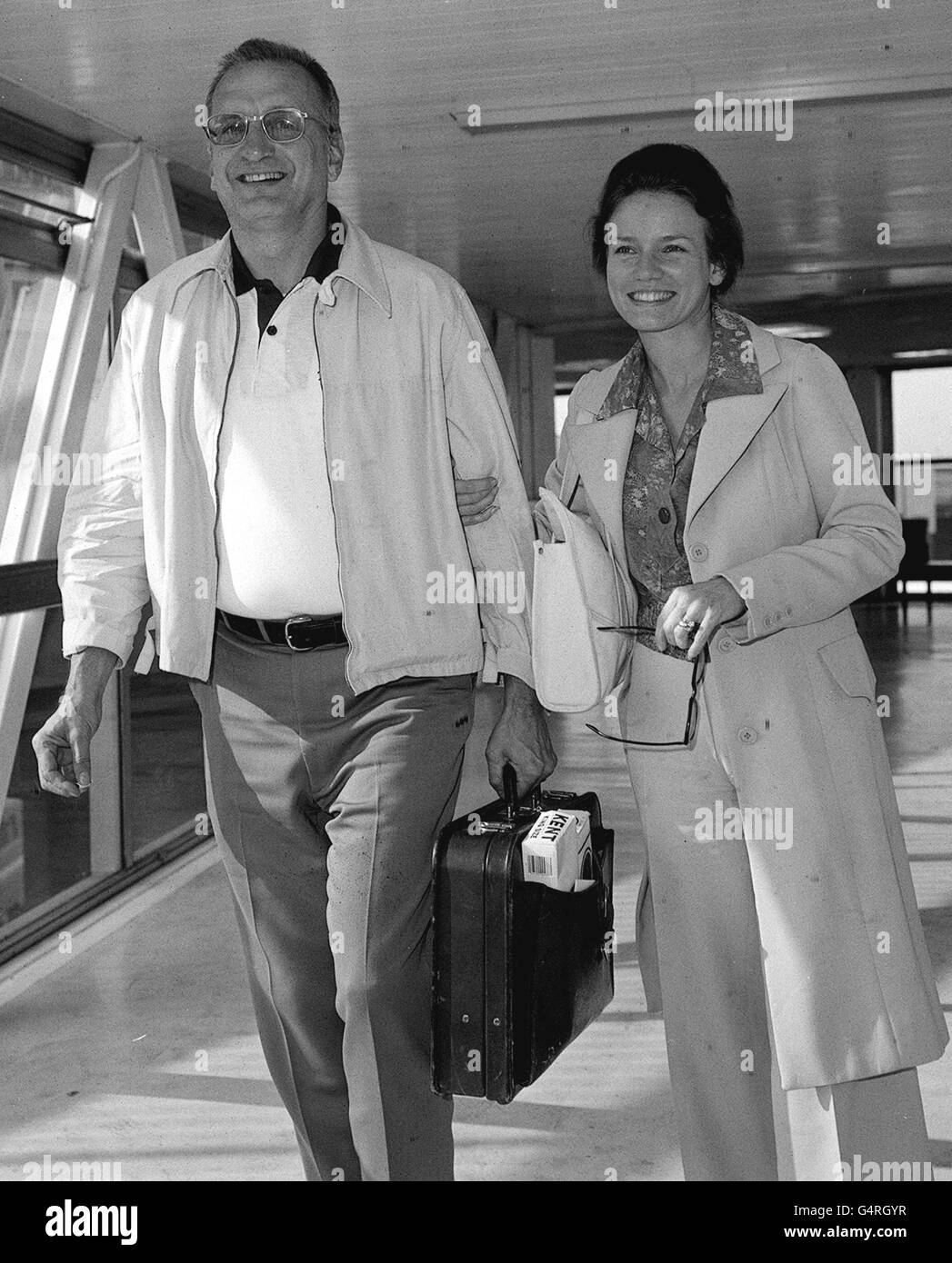 A library file picture dated 20.4.76 of American film star George C.Scott arriving at London's Heathrow Airport with his wife Trish. Scott died yesterday Wednesday 22.9.99. at his home in Westlake Village in Ventura County. He was 71. Picture available in b/w only . Stock Photo