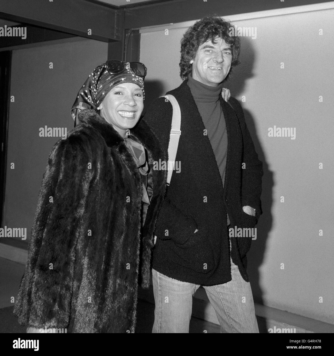 Singer Shirley Bassey walks to her Los Angeles flight at Heathrow Airport with a new mystery boyfriend known only as Mr Lannstrom. She said: 'He is my gentleman friend, but we have no plans to marry. I've got to get a divorce first. I'm not saying anything more about him'. The Welsh singer was setting off on a missive world concert tour which she said would be her last on that scale. Stock Photo