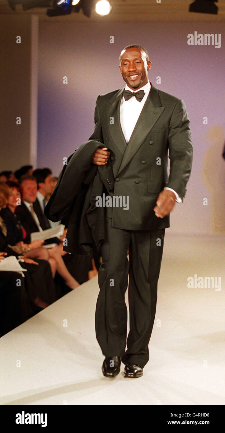 Former Olympic champion Linford Christie walks down the catwalk at the Bond Street Fashion Show in London in aid of the charity NCH Action For Children. Stock Photo
