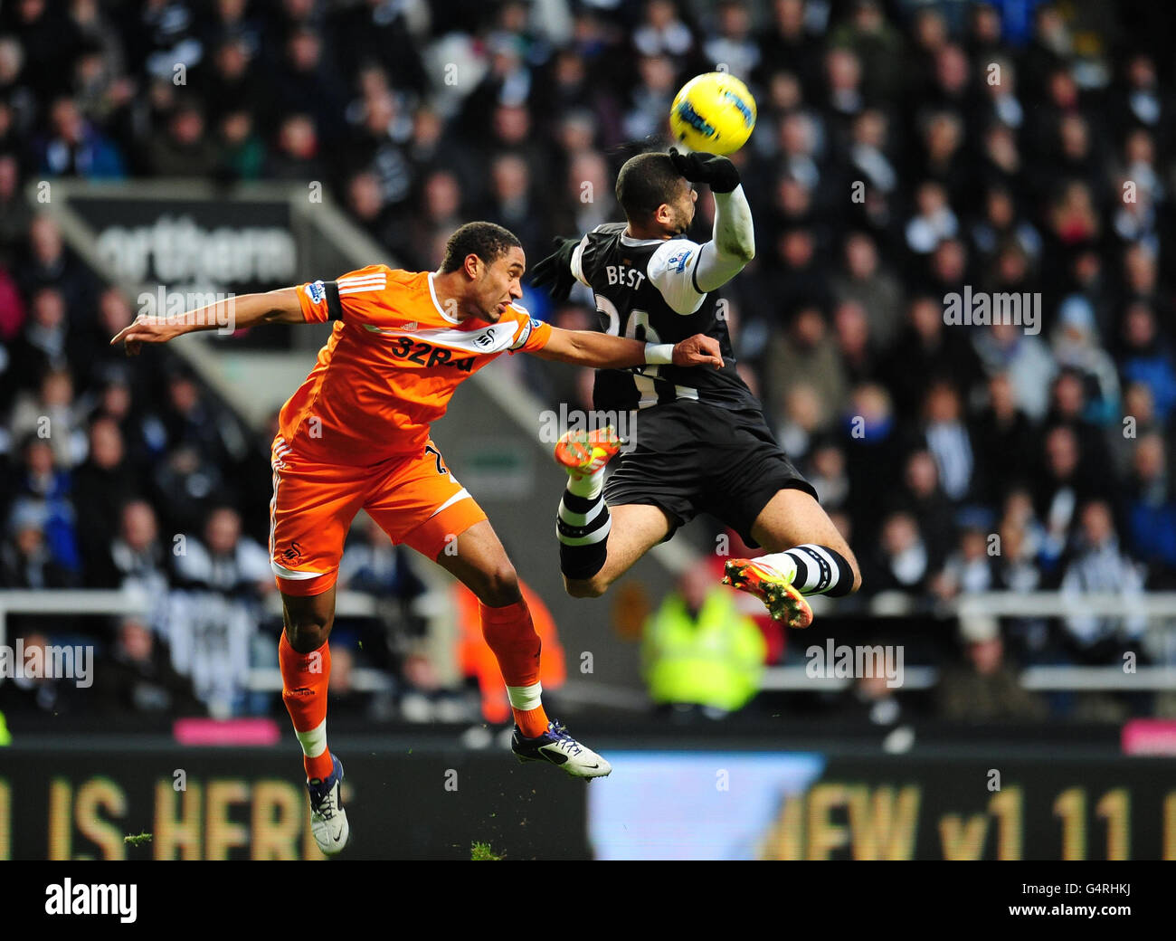 Newcastle's Leon Best is pushed in the back by Swansea's Ashley