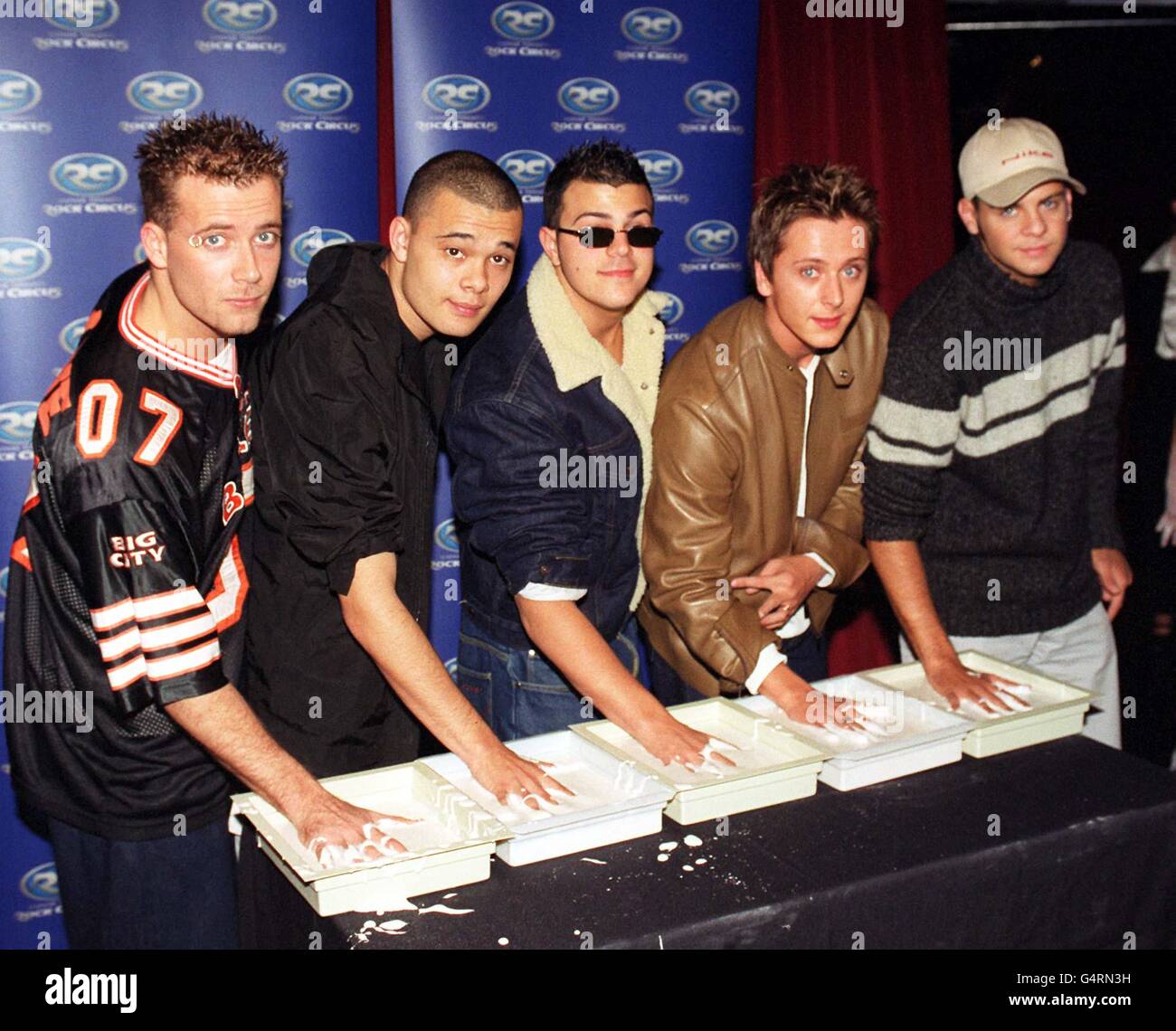 Pop band Five (L-R) J (Jason) Brown, Sean Conlon, Scott Robinson, Ritchie Neville and Abs (Richard) Breen having their hands cast for the 'Wall of Hands' at Madame Tussaud's Rock Circus. Stock Photo
