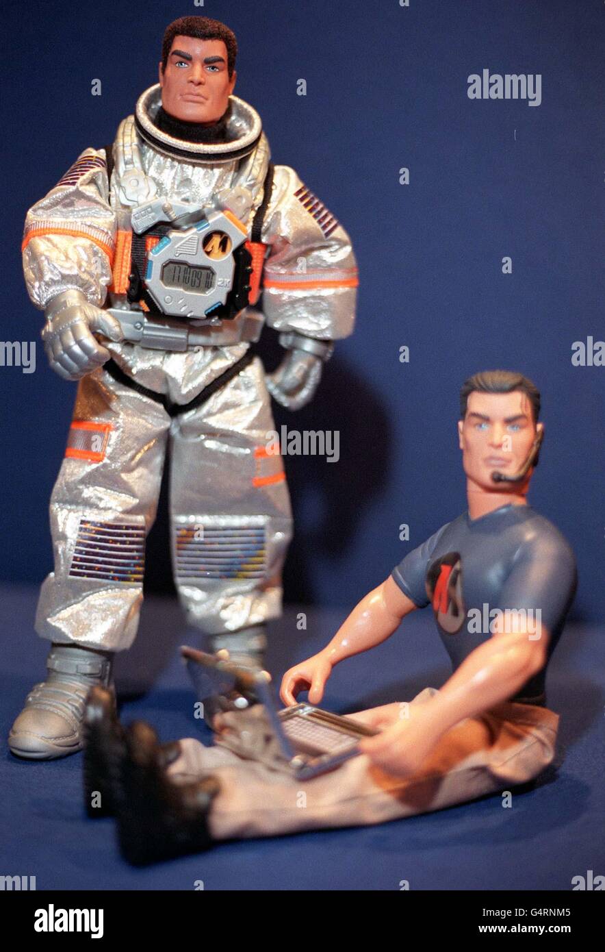 Action Man Mission 2000 (left) and Millennium Action Man, complete with laptop computer and headset, on display during the Toy 99 exhibition in London. Other toys on display included Britney Spears dolls, Pokemon and Furbys. Stock Photo