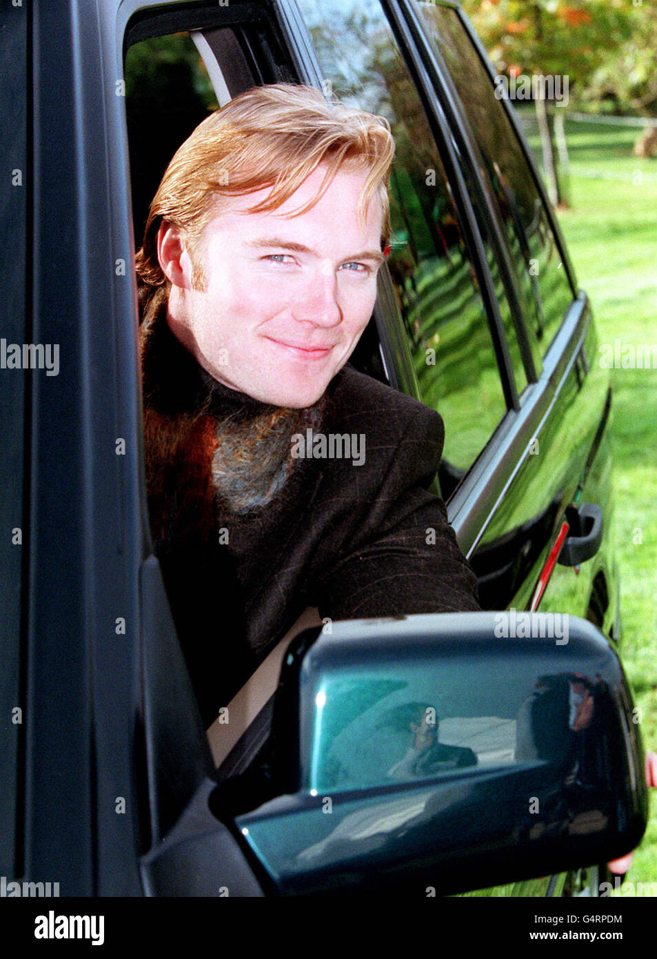 Lead singer of Boyzone, Ronan Keating poses in the Holland & Holland Limited Edition Range Rover, before attending the Holland & Holland Spring/Summer 2000 Mens & Womenswear fashion show, at Northwood in Middlesex. Stock Photo