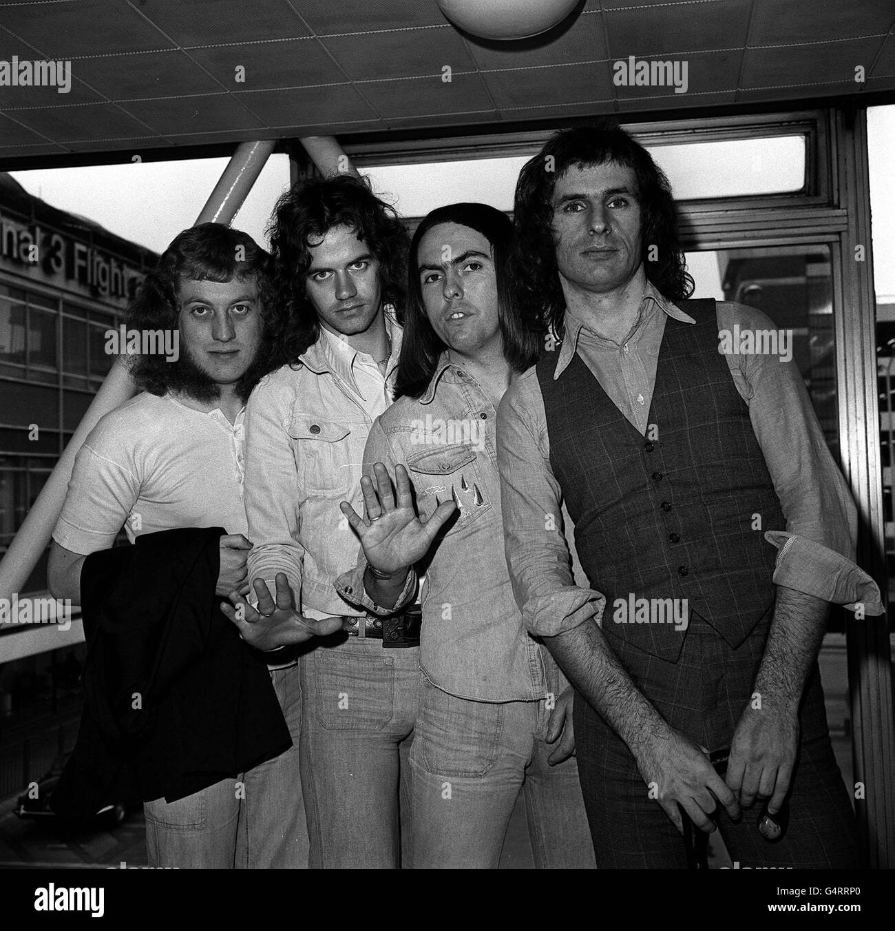 Slade, the pop group (from left) Noddy Holder, Jimmy Lea, Dave Hill and Don Powell, at Heathrow Airport, London before leaving for America, where they are going on tour. Stock Photo