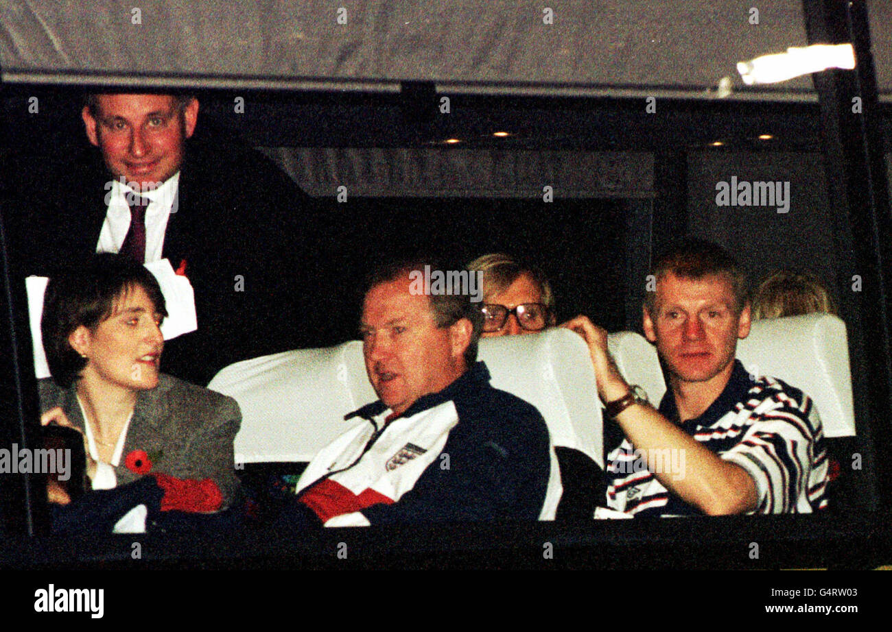 Injured defender Stuart Pearce (right) gazes out of the window as the bus carrying the England team leaves Glasgow airport on their arrival in Scotland. * (Media officer Steve Double top left, others unidentified). Stock Photo