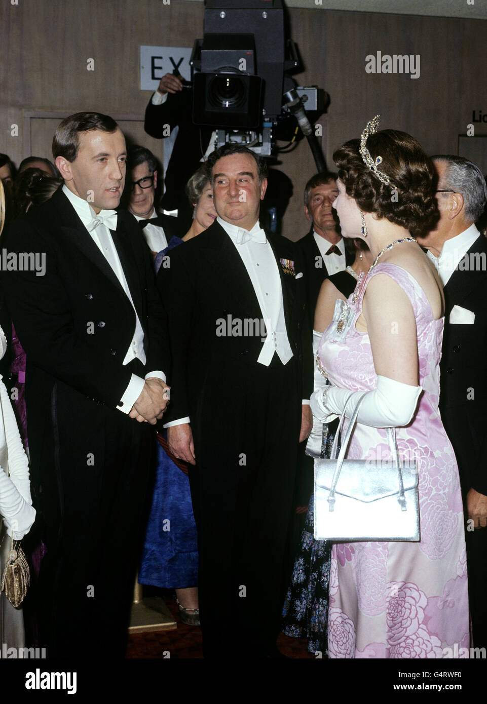 Queen Elizabeth II talking to David Frost at the Royal Film performance of 'Anne of the Thousand Days.' Stock Photo