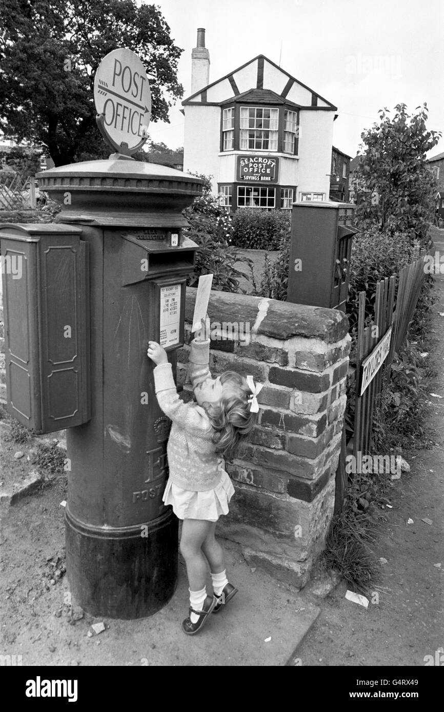 Twoyearold Jacqueline Dixon attempts to post a letter at the