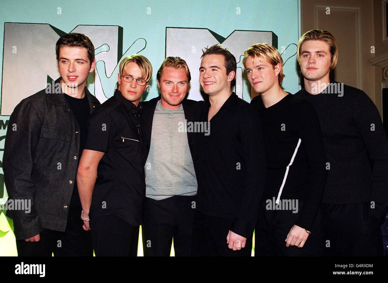 Pop boy band Westlife, with Ronan Keating (3rd left), of Boyzone, arriving at the MTV Europe Music Awards nominations ceremony in London. L-R: Mark Feehily, Kian Egan, Ronan Keating, Shane Filan, Bryan McFadden and Nicky Byrne. Stock Photo
