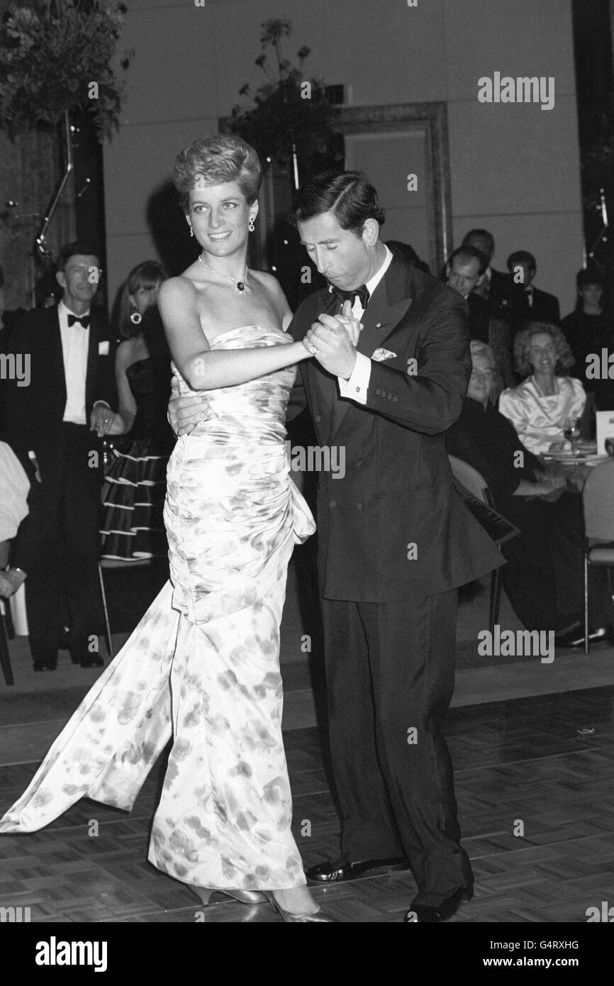 Diana, The Princess of Wales wearing a dress by designer Catherine Walker, a blue and pink rose-patterned silk, dances the night away with husband The Prince of wales in Melbourne, Australia. Stock Photo