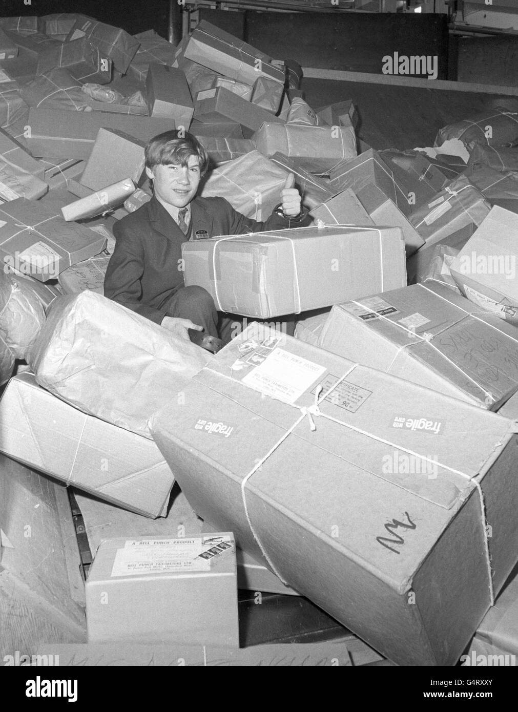 7 per week. As a beginner his job is to deliver telegrams. He is pictured here at London's Western District Office Stock Photo