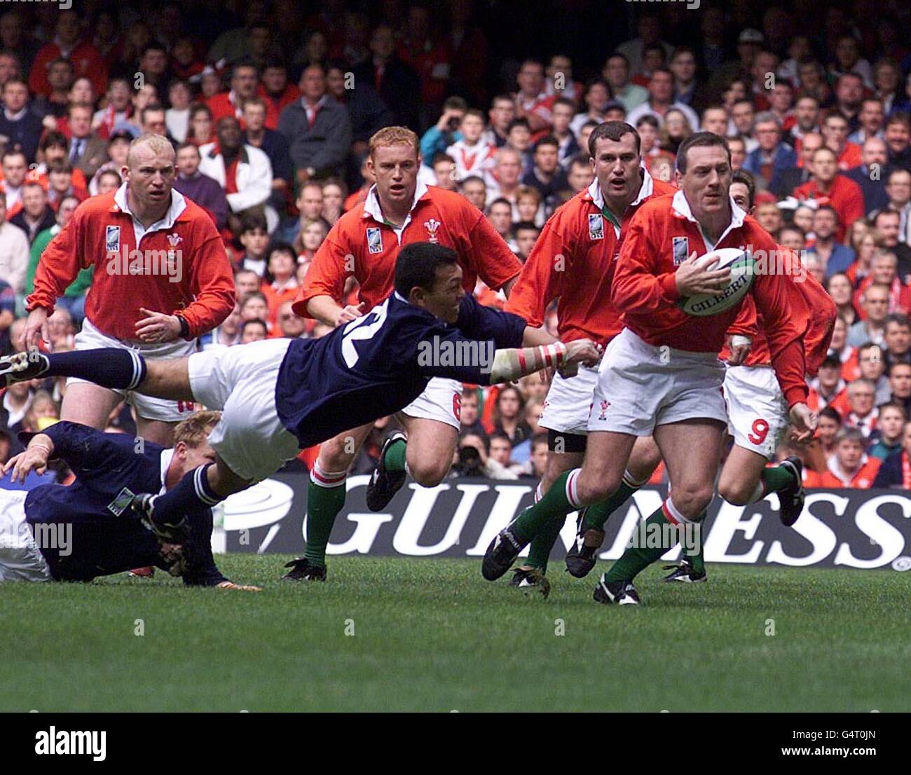 Wales' Alan Bateman leaves the Japanese defence stranded as he breaks ...