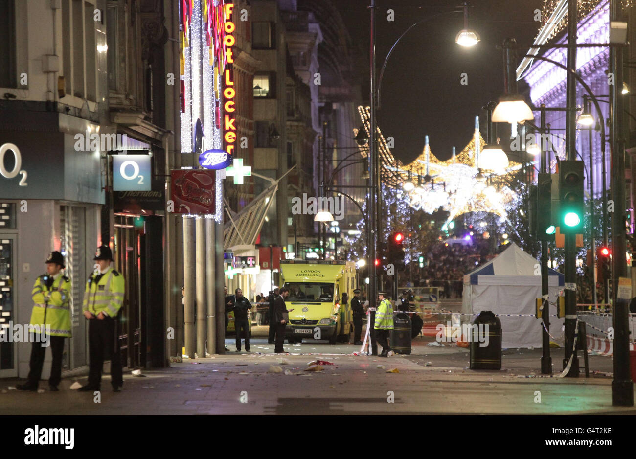 A general view of police at the scene on Oxford Street where a man was stabbed to death today in