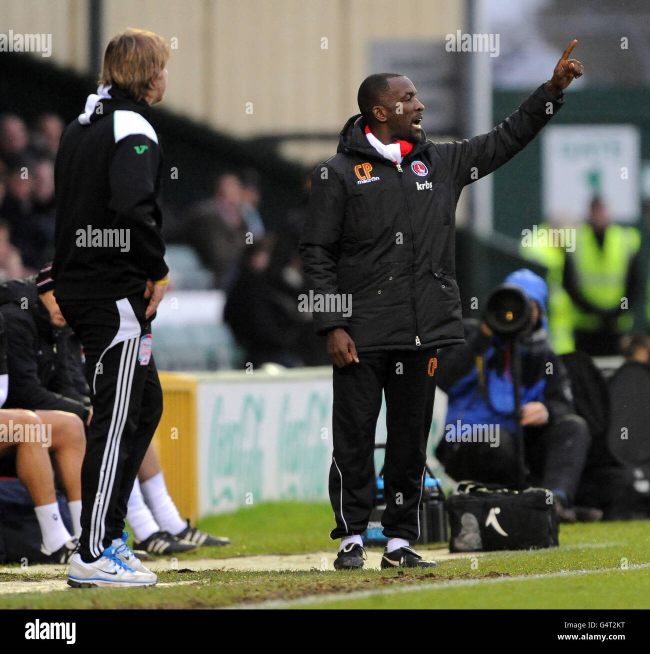 Charlton's manager Chris Powell (right) gives his side instruction from the touch line as Yeovil's manager Terry Skiverton (left) looks on during the npower Football League One match at Huish Park, Yeovil. Stock Photo
