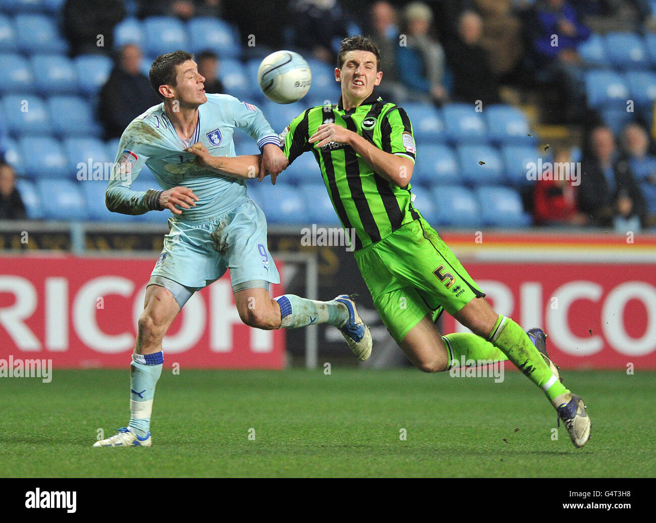 Coventry City's Lucas Jutkiewicz and Brighton & Hove Albion's Lewis Dunk battle for the ball during the npower Championship match at the Ricoh Arena, Coventry. Stock Photo