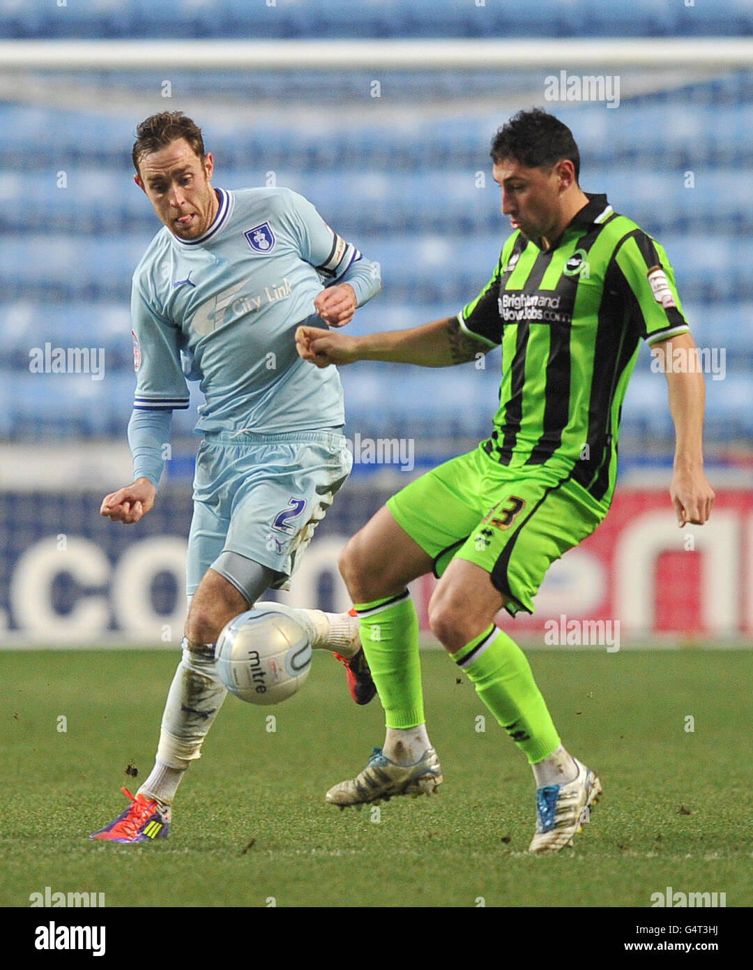 Coventry City's Richard Keogh and Brighton & Hove Albion's Billy Paynter battle for the ball during the npower Championship match at the Ricoh Arena, Coventry. Stock Photo