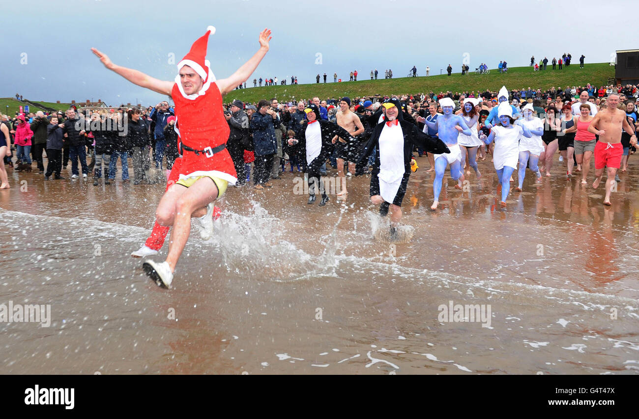 People enjoy the New Year's Day dip at Whitley Bay in Northumberland ...
