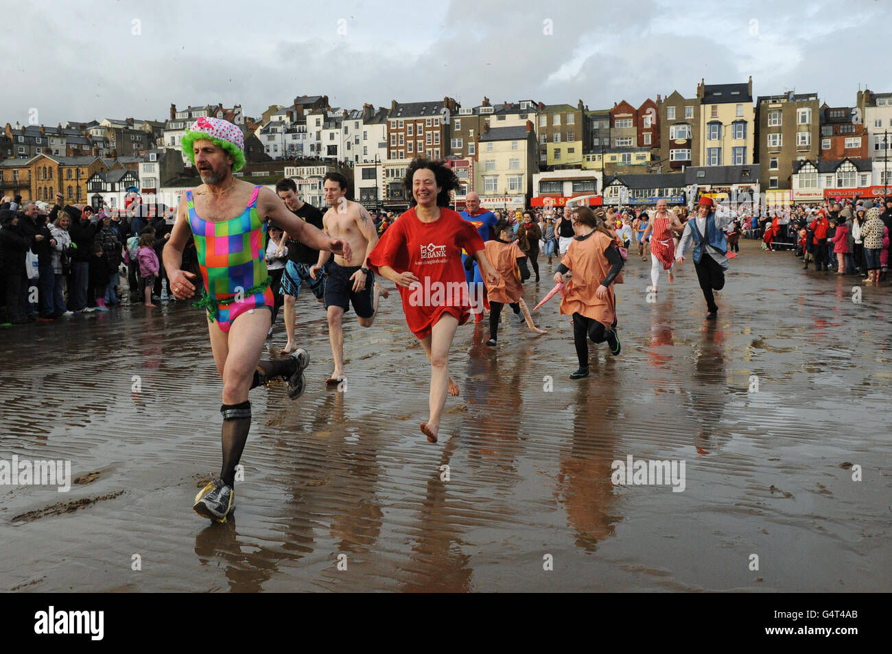 Swimmers take to the water for the annual New Year's Day dip in the ...