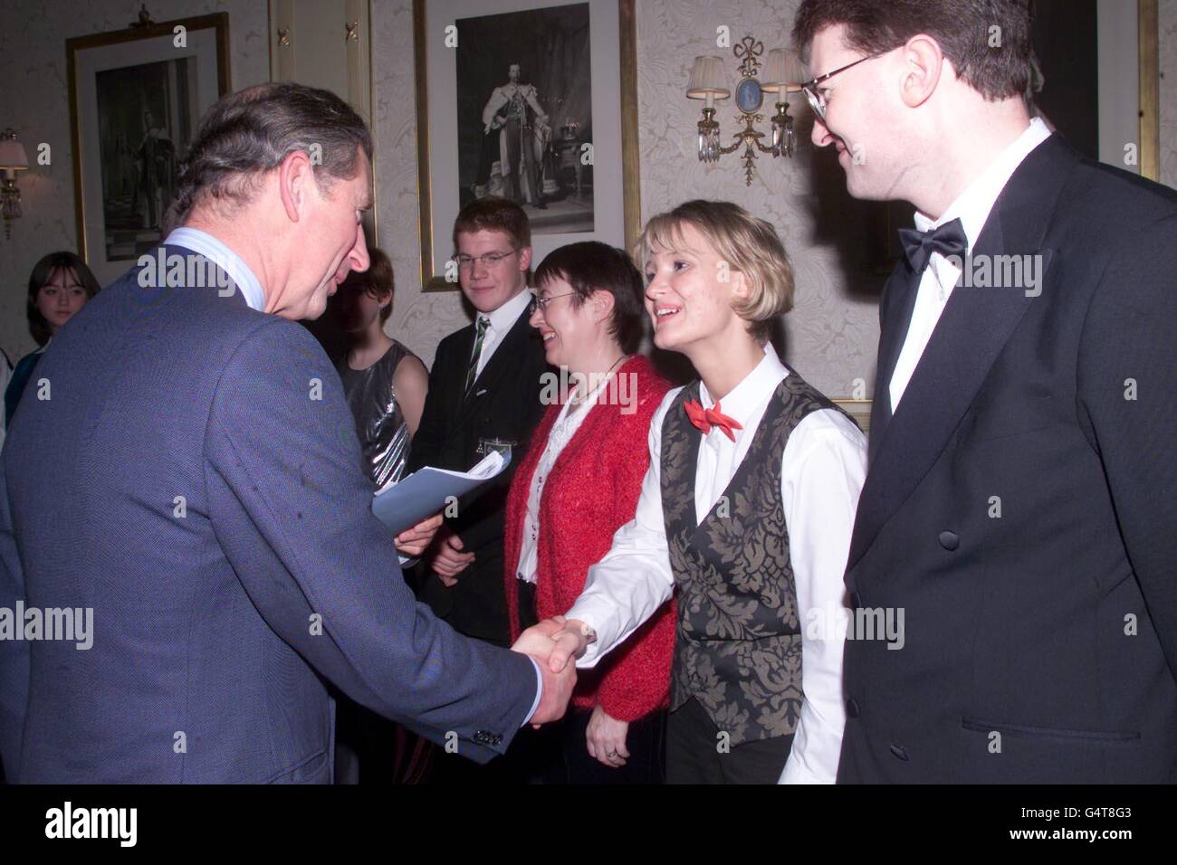 The Prince of Wales meets Lynsey Hayes, cornett player with the Smithills School Senior Brass Band, at a Music For Youth Schools Prom, at the Royal Albert Hall. The Prince had personally asked to meet the Bolton schoolgirl, after hearing a CD of her playing. * and the school's head of music Chris Wormald (R). Stock Photo