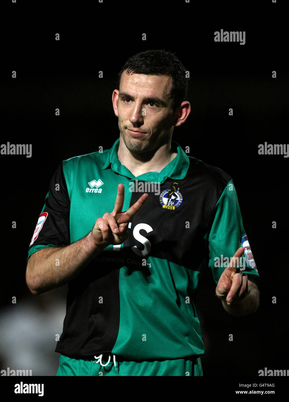 Bristol Rovers' Craig Stanley gestures towards the fans to show them