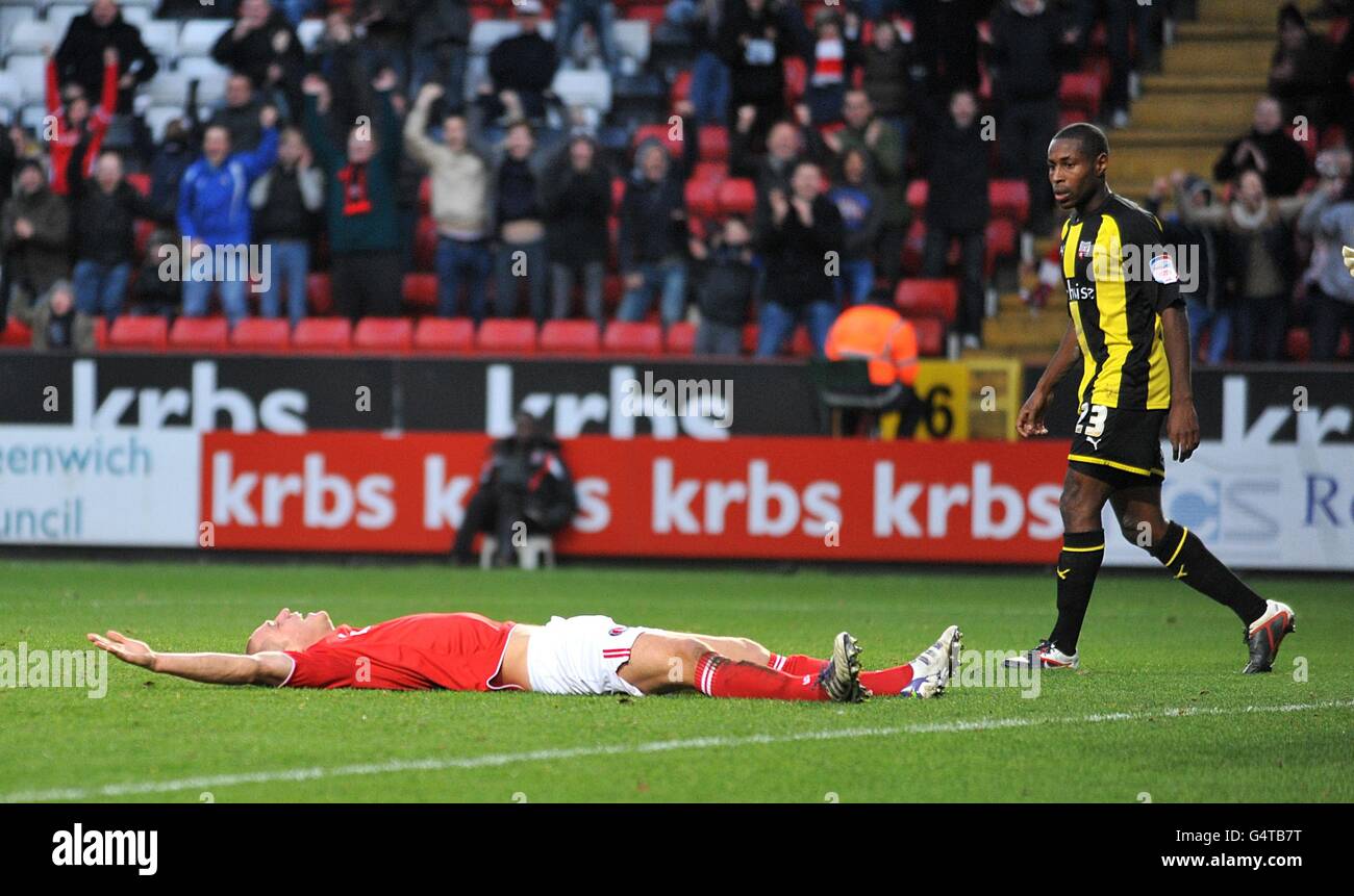 Charlton Athletic's Michael Morrison (left) lies on the floor as he celebrates after heading home the opening goal of the game Stock Photo