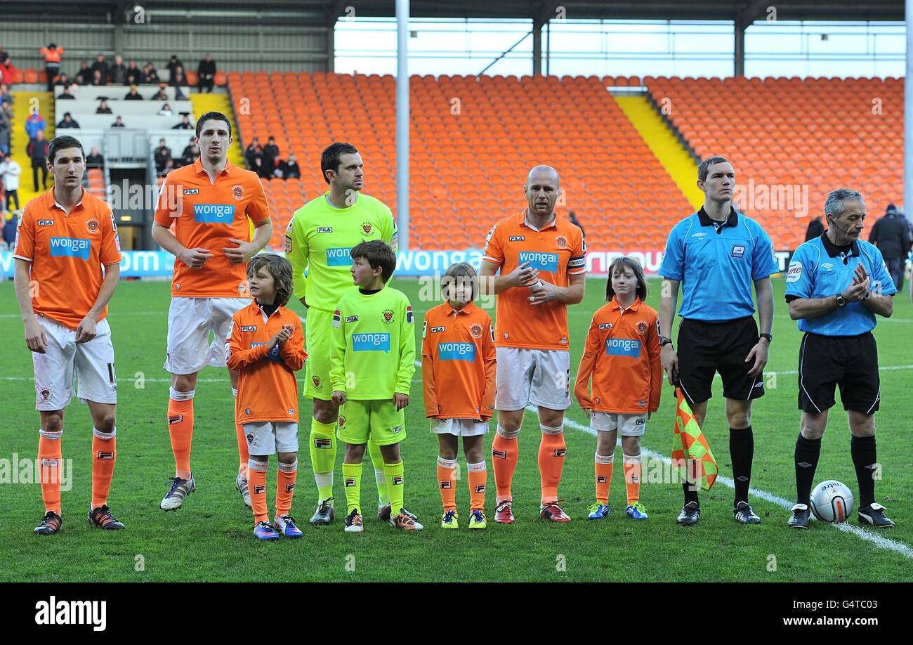 Blackpools players line up with the mascots before the game hires