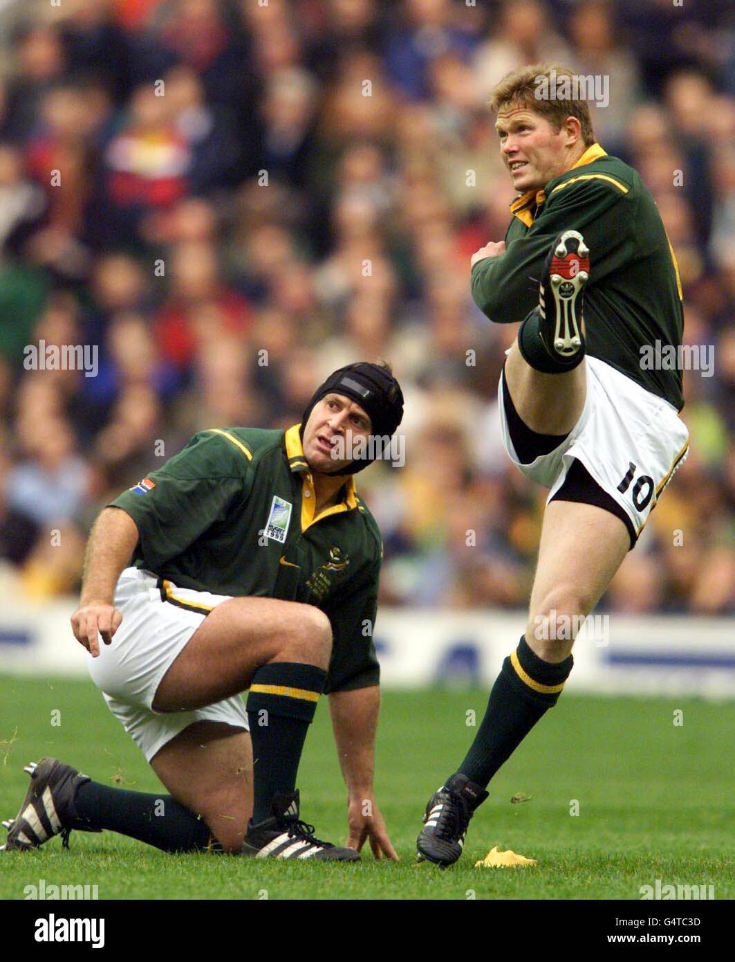 South Africa's Jannie de Beer kicks a penalty as ball holder Naka Drotske looks on during their Rugby World Cup semi-final against Australia at Twickenham in London. Stock Photo