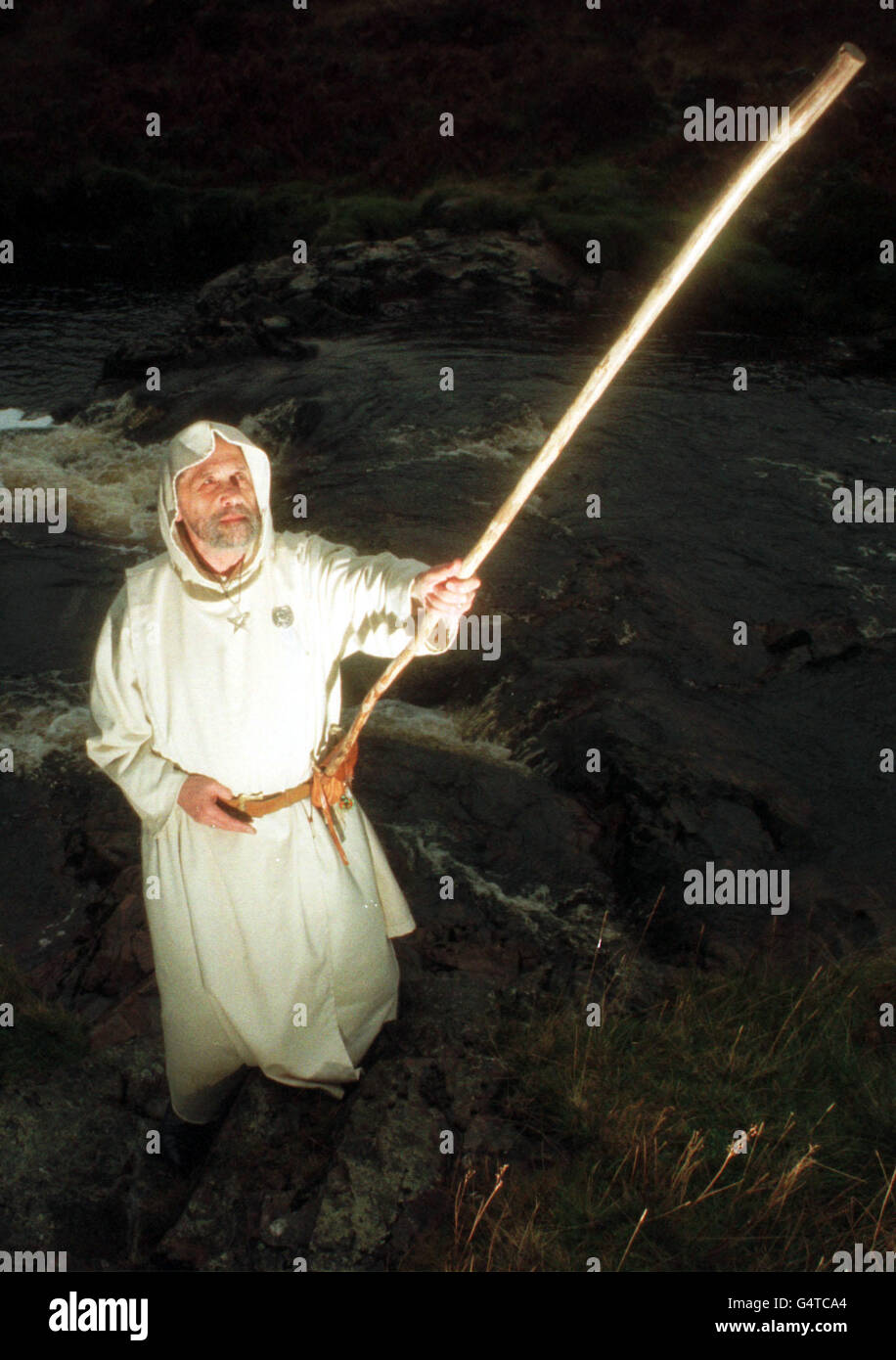 Druid Chris Turner, from Ayrshire, of the Druids of Albion, prepares himself to conduct the ceremony of the ancient feast of Samhuinn, which marks the start of winter and coincides with the old Celtic New Year, at Clyde Muirshiel Country Park in Scotland. Stock Photo