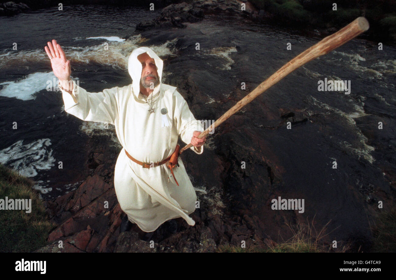 Druid Chris Turner, from Ayrshire, of the Druids of Albion, prepares himself to conduct the ceremony of the ancient feast of Samhuinn, which marks the start of winter and coincides with the old Celtic New Year, at Clyde Muirshiel Country Park in Scotland. Stock Photo