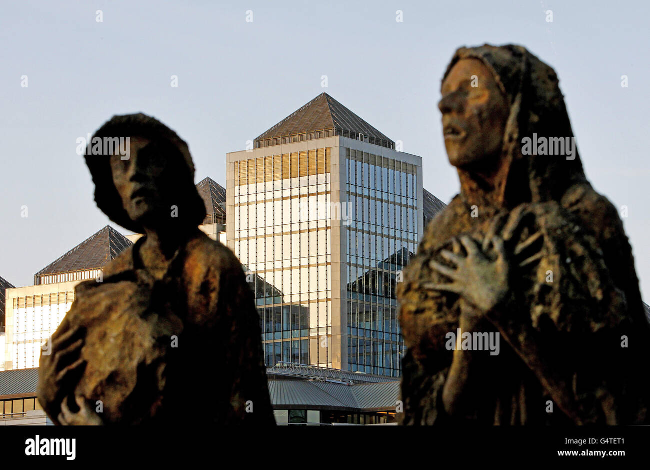 A general view of the Ulster Bank Headquarters seen behind the Irish Famine memorial by artist Rowan Gillespie in Dublin city centre as the bank is expected to announce up to 900 job losses in the Republic of Ireland and Northern Ireland today as part of massive cutbacks at its parent company. Stock Photo
