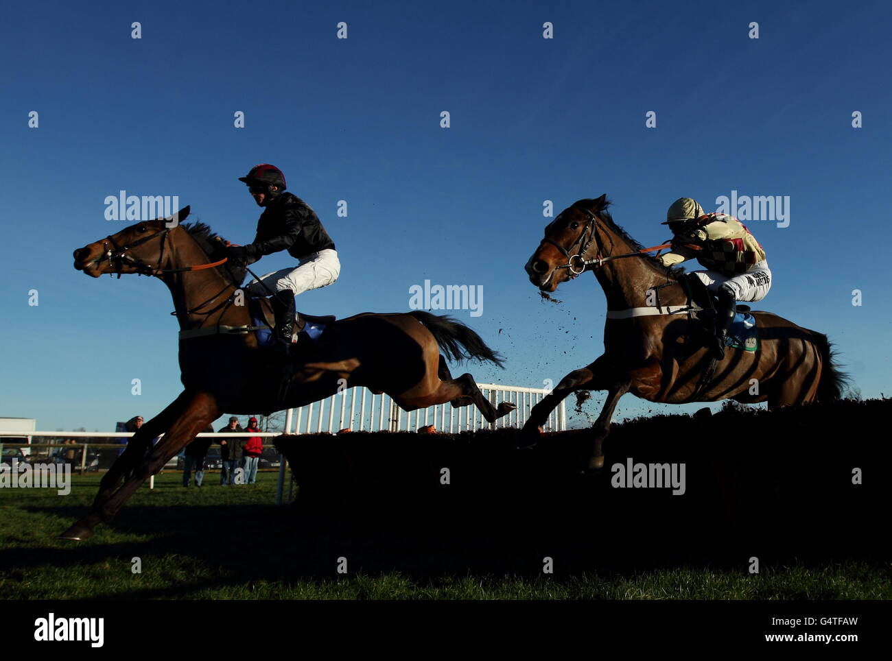 (left to right) Creekside ridden by Jack Quinlan jumps the last on the way to winning The yorkshire-outdoors.co.uk juvenile maiden hurdle race from Uncle Bryn Dougie Costello Stock Photo