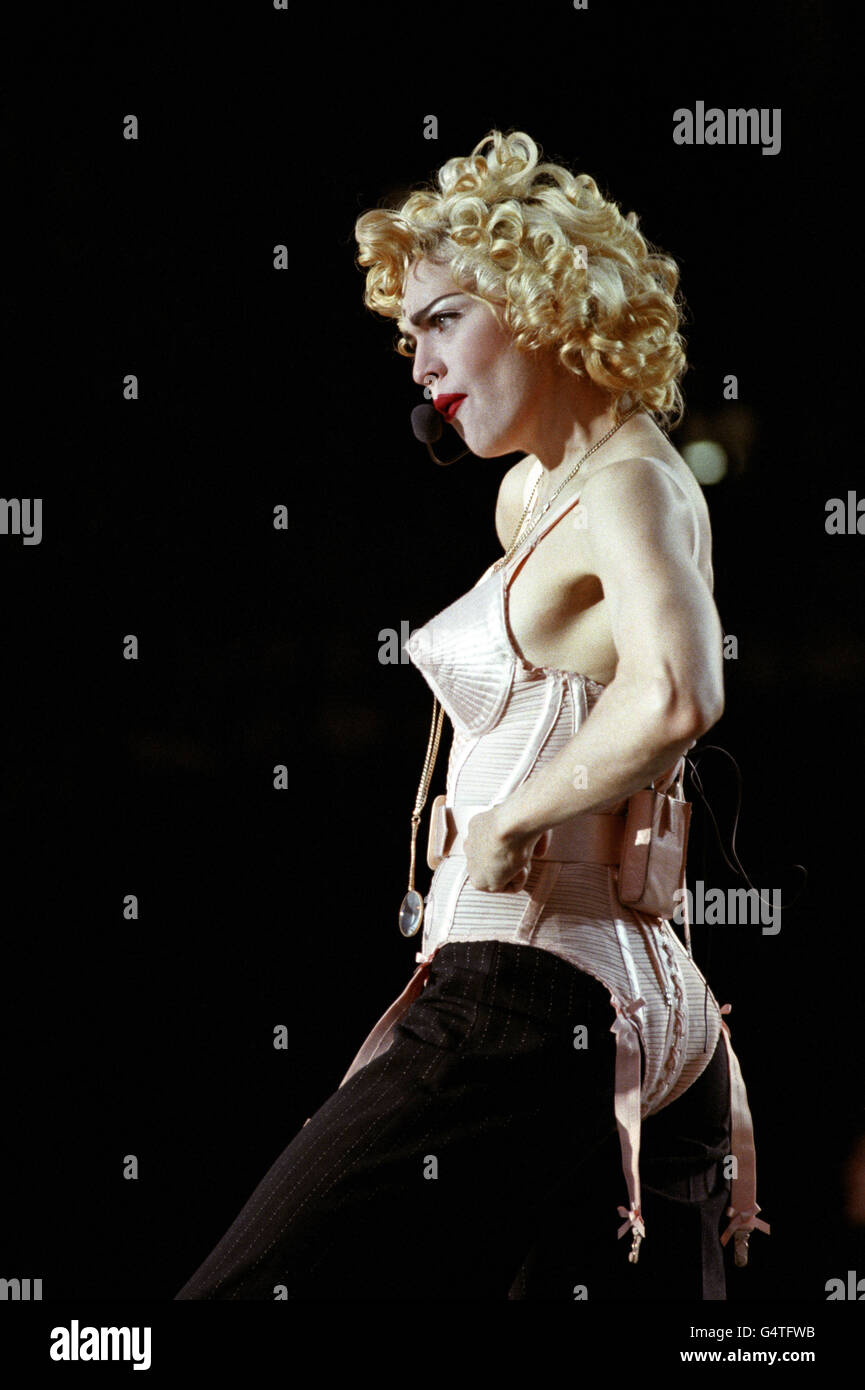 Pop singer Madonna performing to a crowd of 74,000 fans at Wembley Stadium, in London. Stock Photo