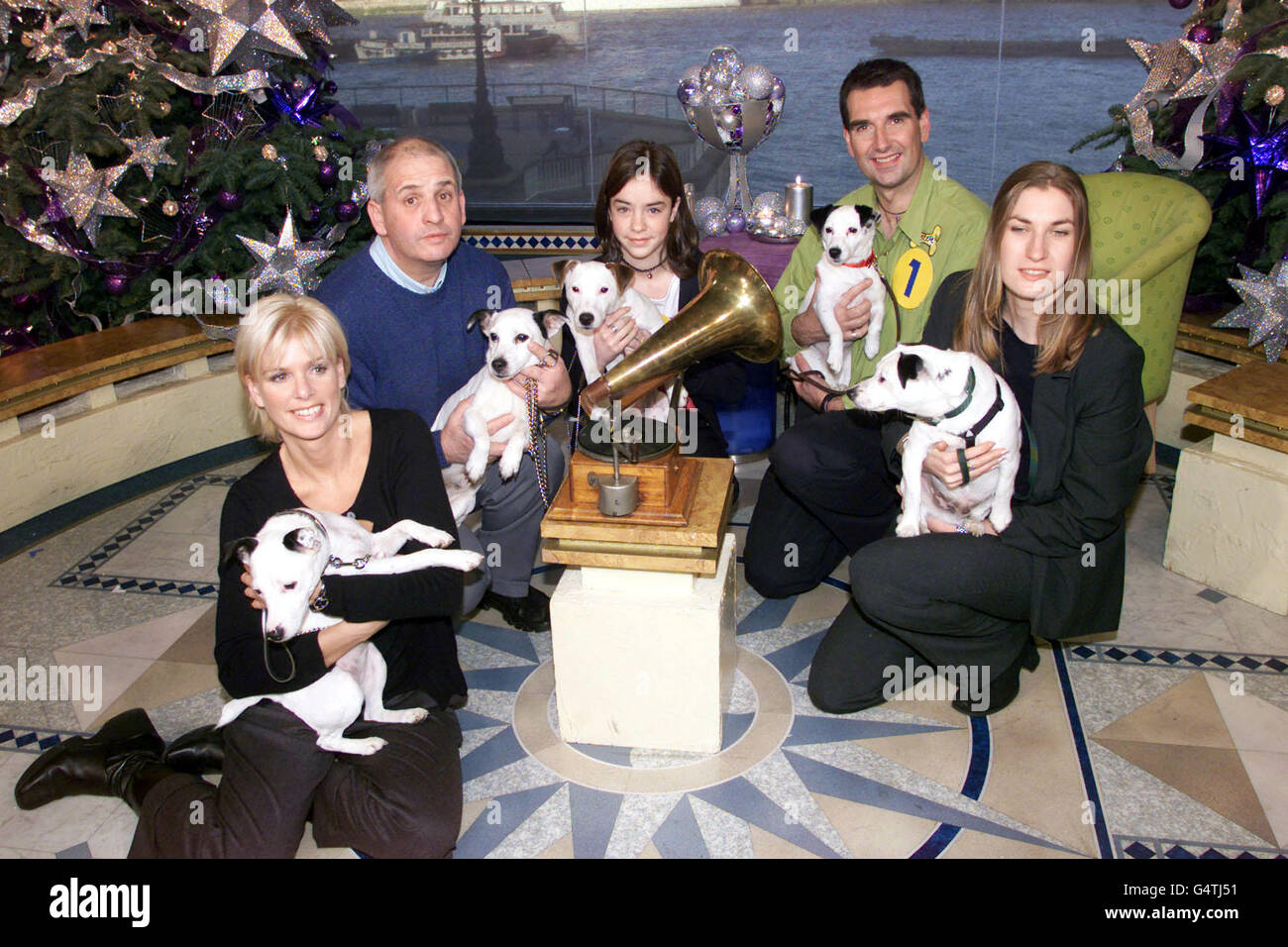 The shortlisted terrier dogs and their owners competing for the new mascot of the HMV chain on ITV's This Morning. (L-R) Lisa Davies and Meg (the winners), Dave Leigh and Nipper, Sam Tale and Ricky, Steve Dickens and Nippy and Julie Prescott and Ben. * The music chain is renowned for its dog and trumpet logo featuring a Jack Russell staring quizzically into a gramophone. HMV has been looking for a new representative since the old one retired after 10 years of service. Stock Photo