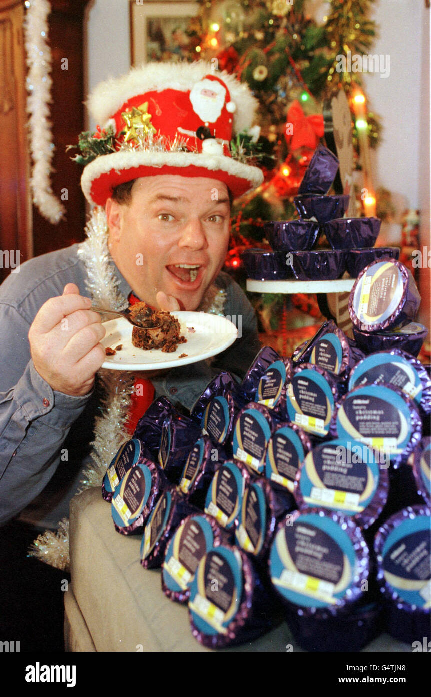 The self-styled Mr Christmas, aka engineer Andy Park with some of the 366 Christmas Puddings, given to him free of charge by chain store Marks & Spencers at his home in Melksham, Wilts. * Mr Park celebrates Christmas every day, he opens presents, tucks into a turkey roast and watches the Queen's speech on a daily basis. PA photo: Tim Ockenden. Stock Photo