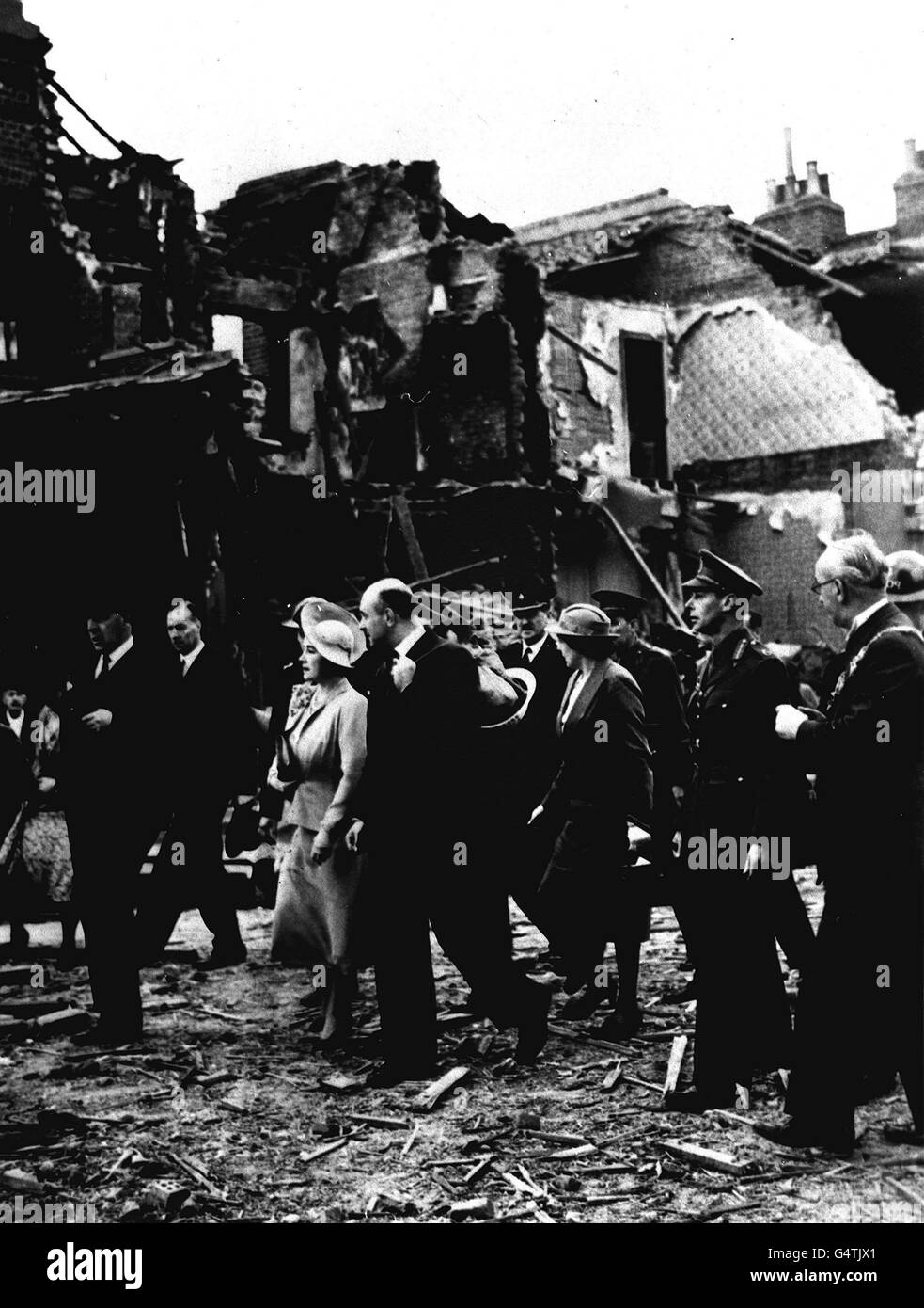 The Queen Mother and King George Vi tour bombed areas of south London in 1940.. The Queen Mother and King George Vi tour bombed areas of south London in 1940. Stock Photo
