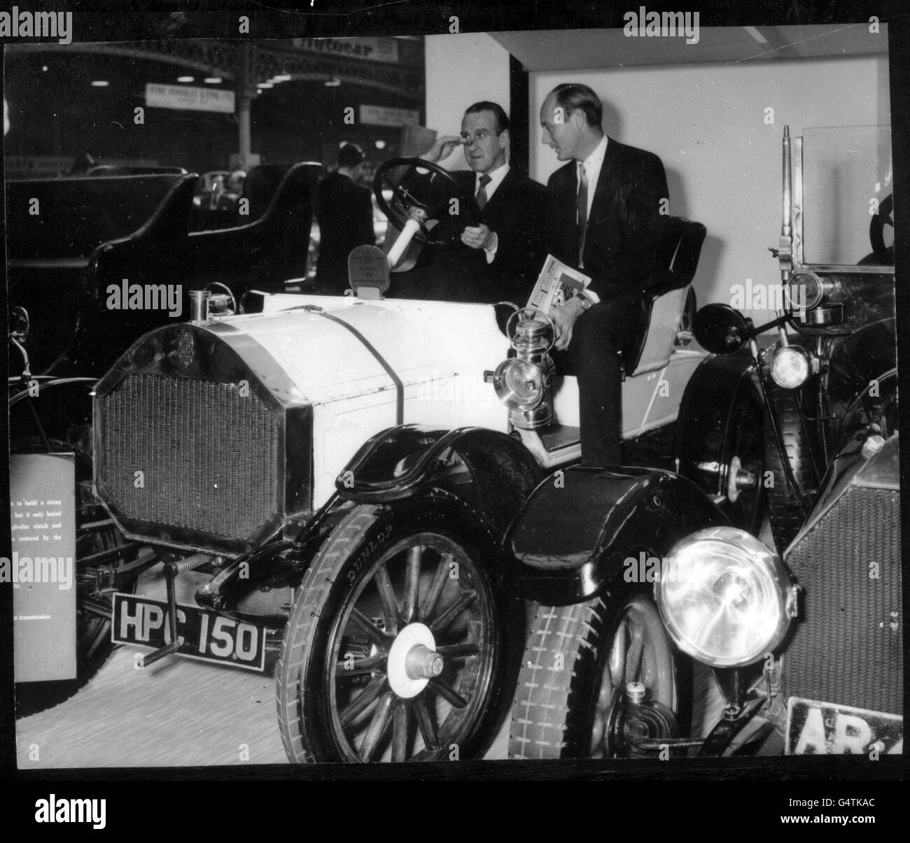 *Scanned low res from a contact* Ernest Marples, MP, the Minister of Transport, sits at the wheel of a 1909 Humber at the Used Car Show, which he opened at Olympia. With him is Lord Montagu of Beaulieu. Stock Photo