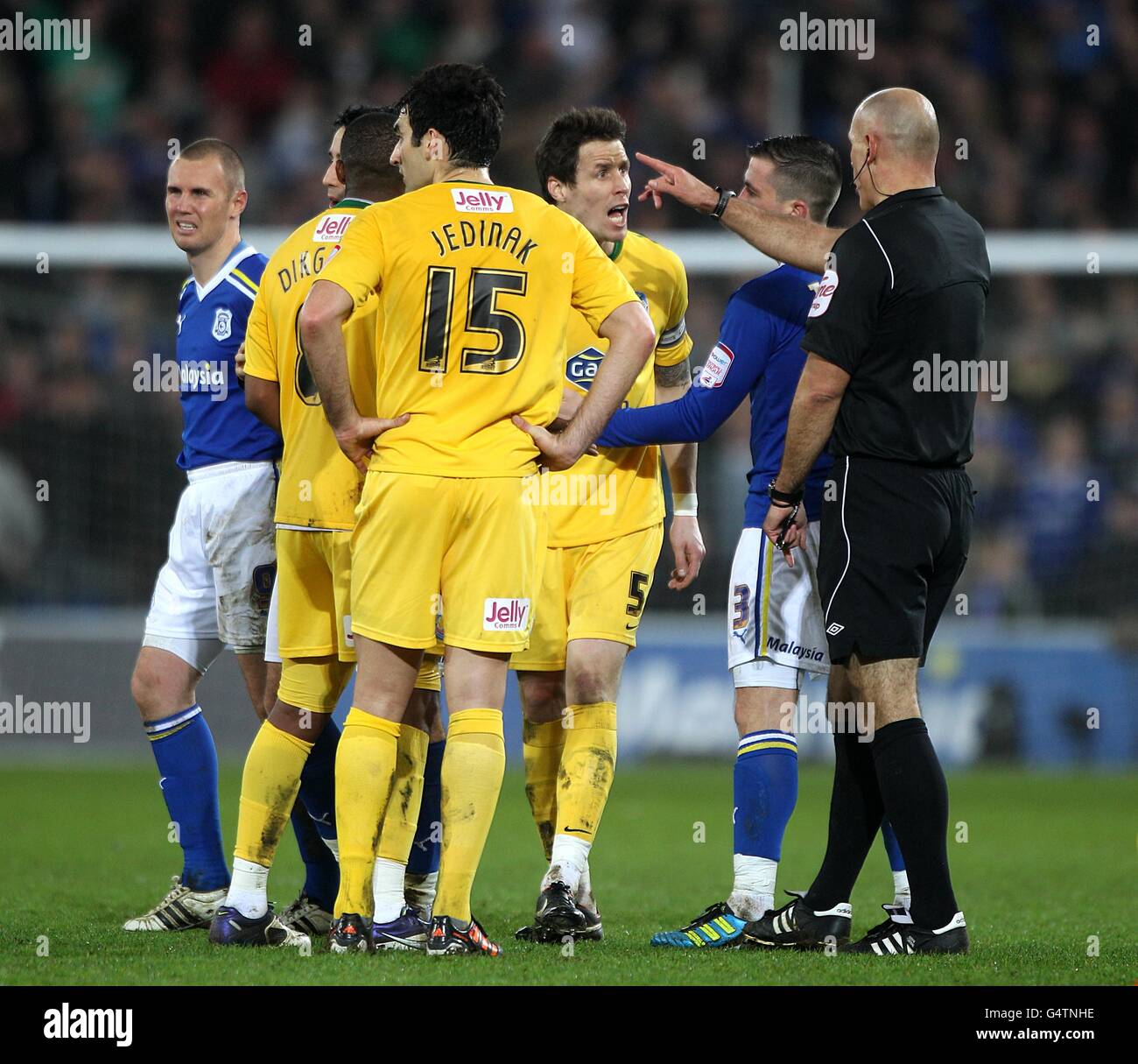Crystal Palace's Patrick McCarthy (centre, back) reacts after being shown a red card by referee Howard Webb for his challenge on Cardiff City's Kenny Miller Stock Photo