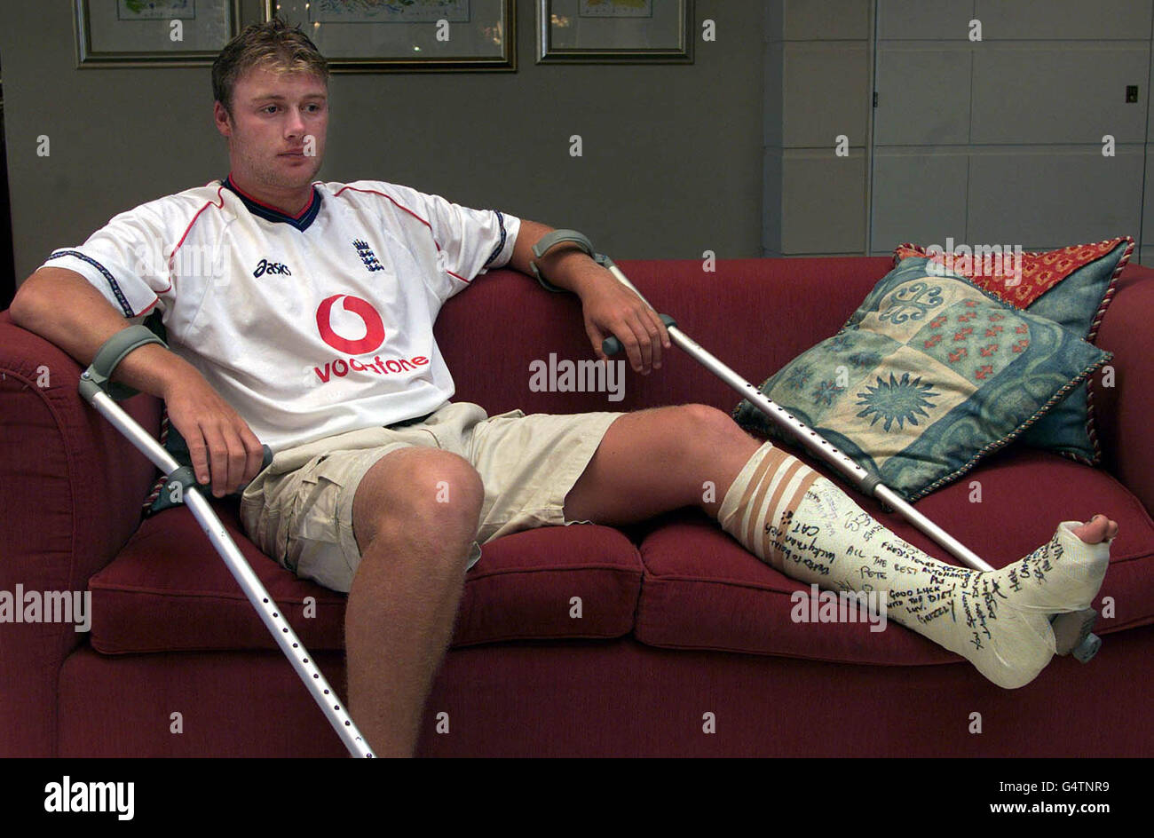 England cricketer Andrew Flintoff wearing a plastercast signed by team