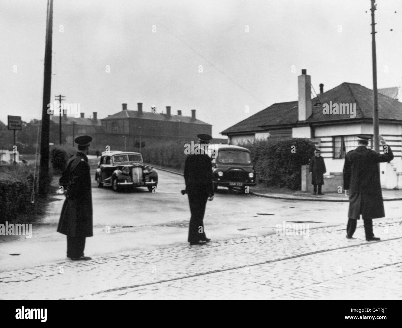 Magistrates cars are seen leaving Barlinnie Prison, Glasgow, after the execution of Peter Thomas Anthony Manuel, the 32 year old woodworker who was found guilty of murdering seven people. Stock Photo