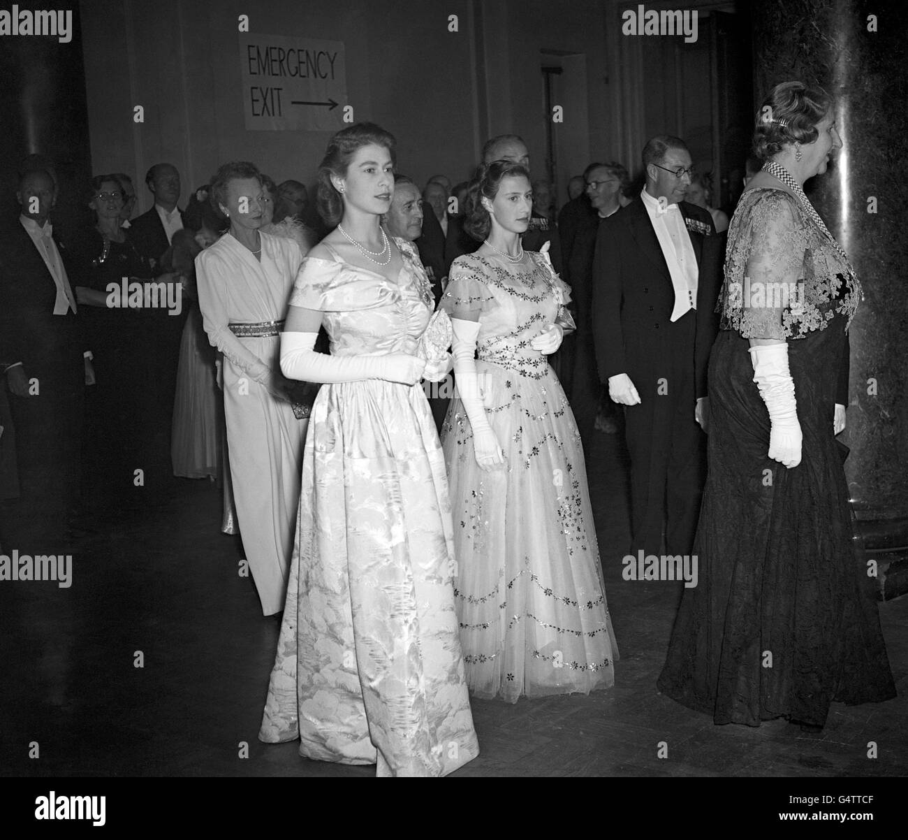 Princess Elizabeth and Princess Margaret, right, at a reception in London held by the Chairman of the London County Council (Lady Nathan) at County Hall in Westminster, for their Majesties the King and Queen. Stock Photo