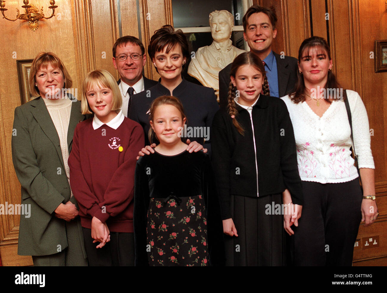 From left to right; (top row) Mrs Sue Crosswell, Mr Leslie Wilson, Cherie Blair, Exeter MP Mr Ben Bradshaw and Mrs Venn, (front row) Miss Bryony Crosswell, Miss Jennifer Wilson and Miss Nikita Venn during a tea party at10 Downing Street. Stock Photo